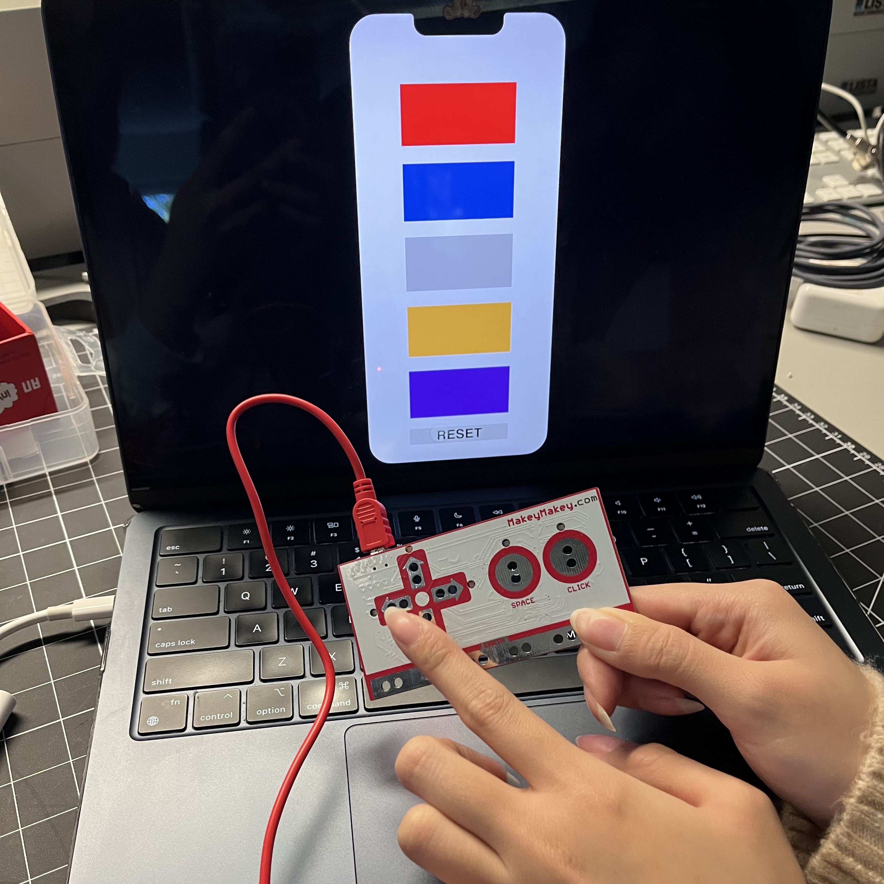A physical interaction with the Makey Makey that produces a digital colour output by corresponding to certain key presses