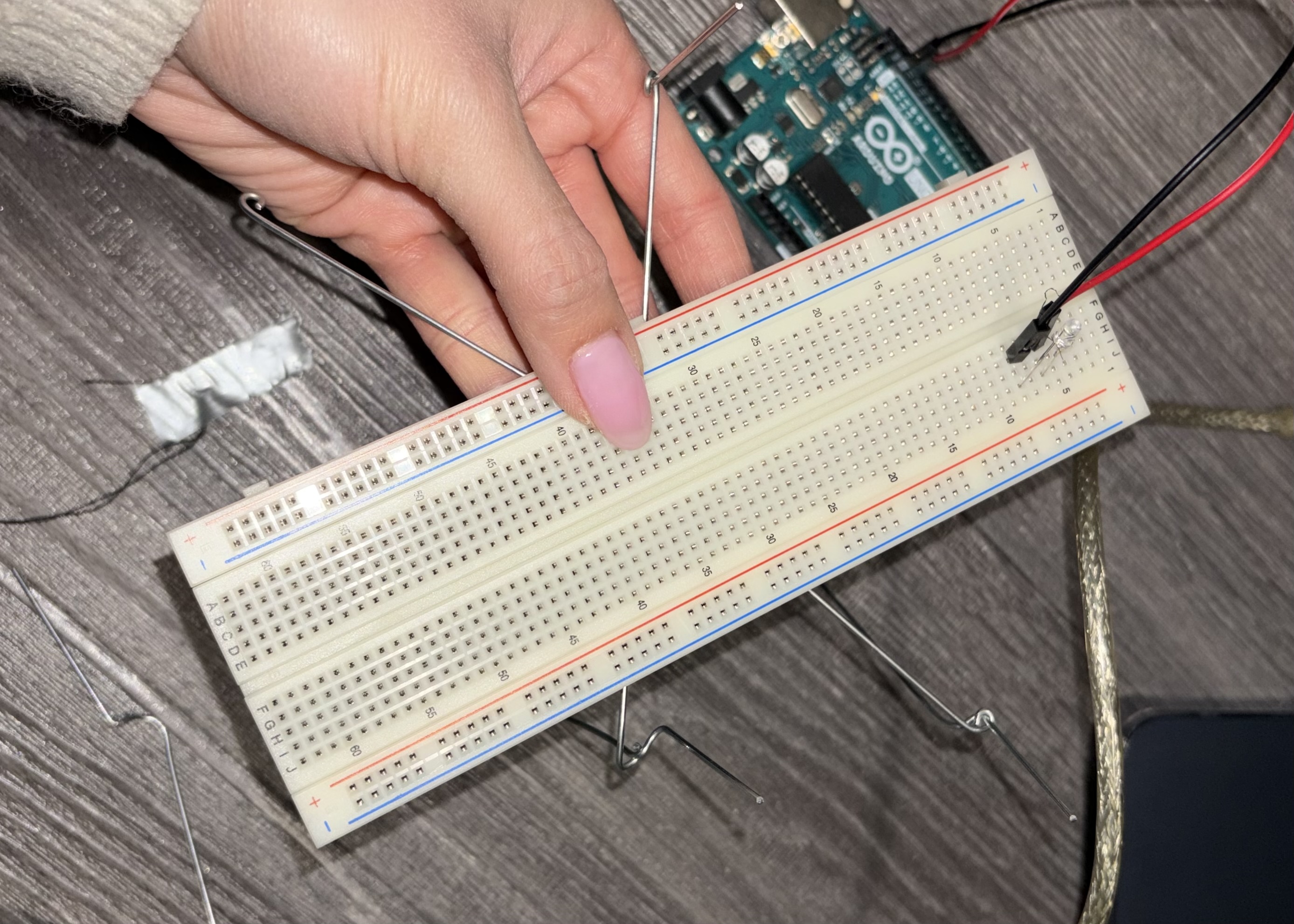 Testing the breadboard on the wire to see if it holds