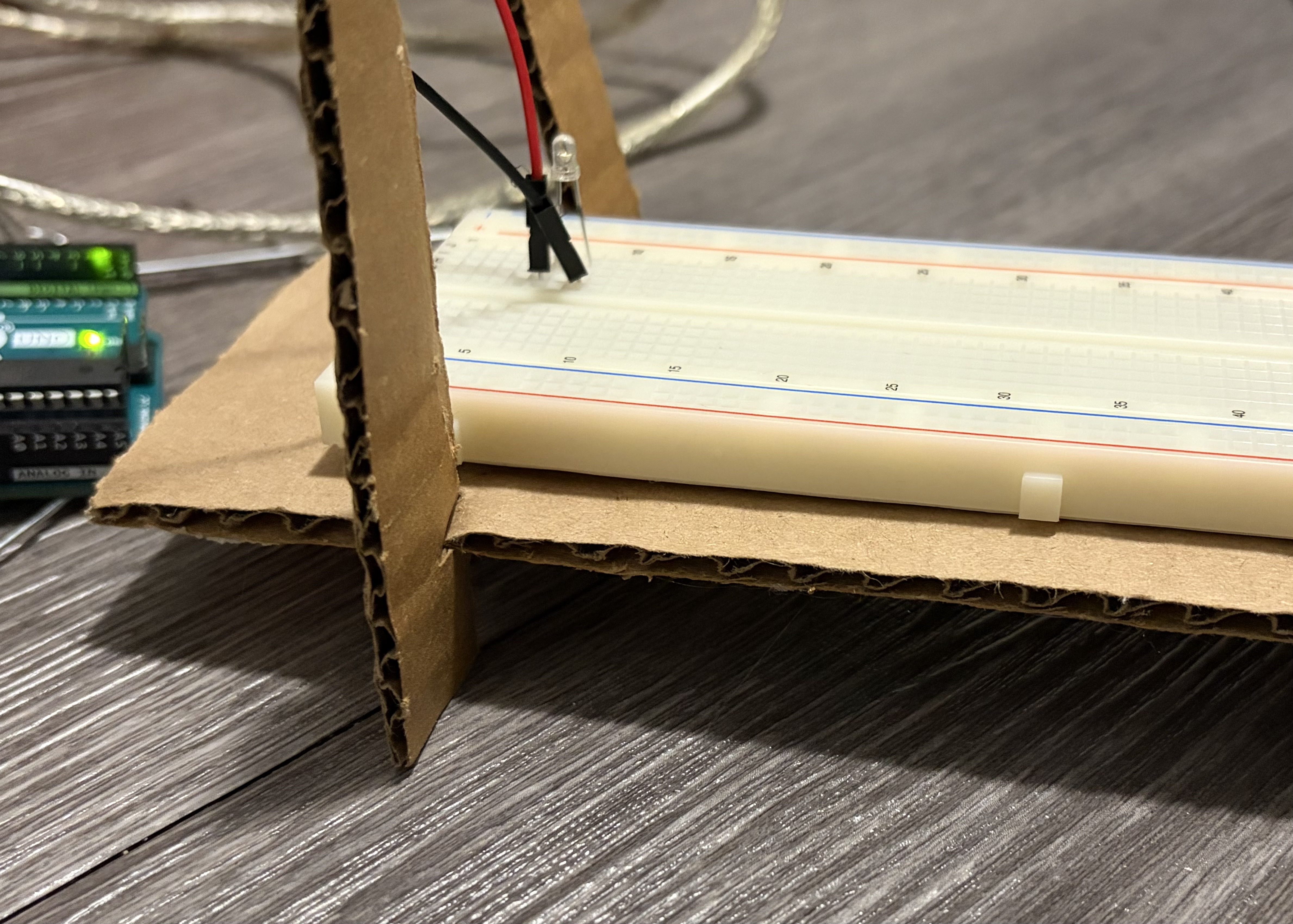 Bottom view of cardboard structure with a space at the bottom